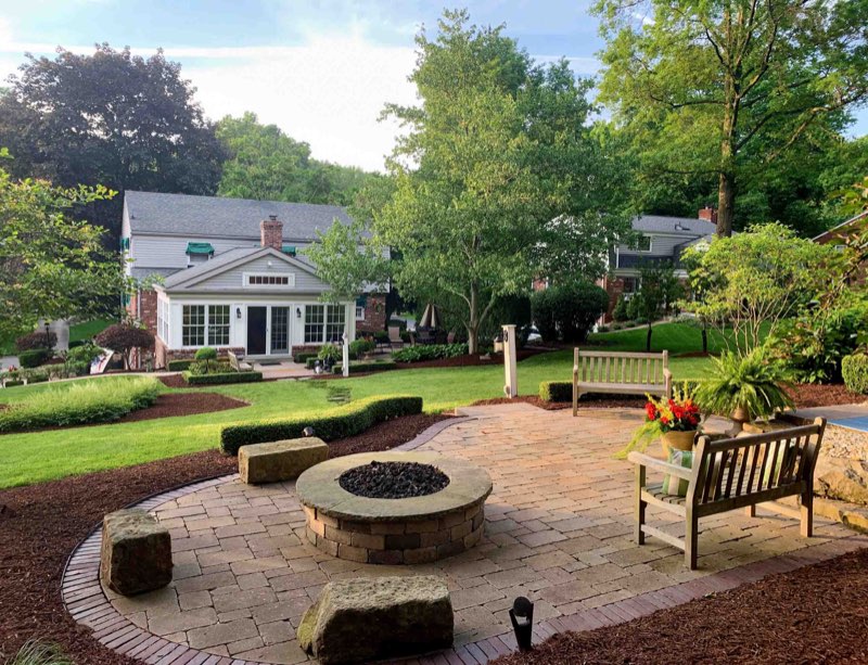 Outdoor living patio space with seating wall