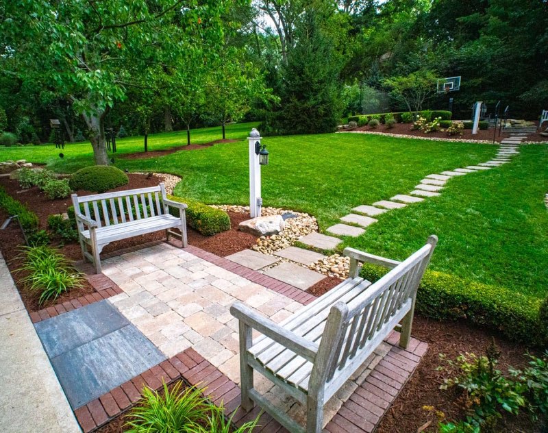 Paver patio with benches and landscape design in Upper St. Clair, PA